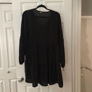 Black long sleeved Foley dress. Never been worn. Great condition.